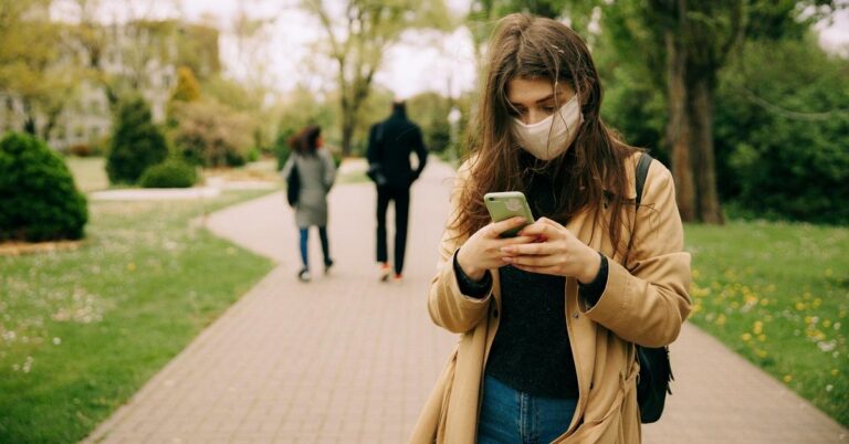 How can you use your Apple Watch to unlock your iPhone while wearing the face mask?