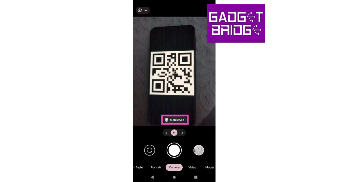 Go back to the camera app and point your camera at the QR code