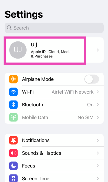 Step 1: Go to Settings and tap on your name at the top of the screen.