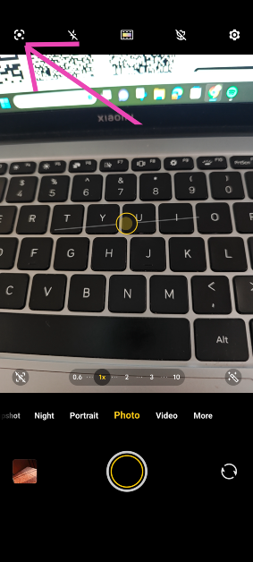 Step 2: Hit the Google Lens icon at the top left corner of the screen.