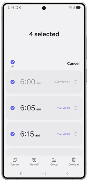 Step 2: Long-press an alarm to select it. Once it is selected, tap other alarms to select them.