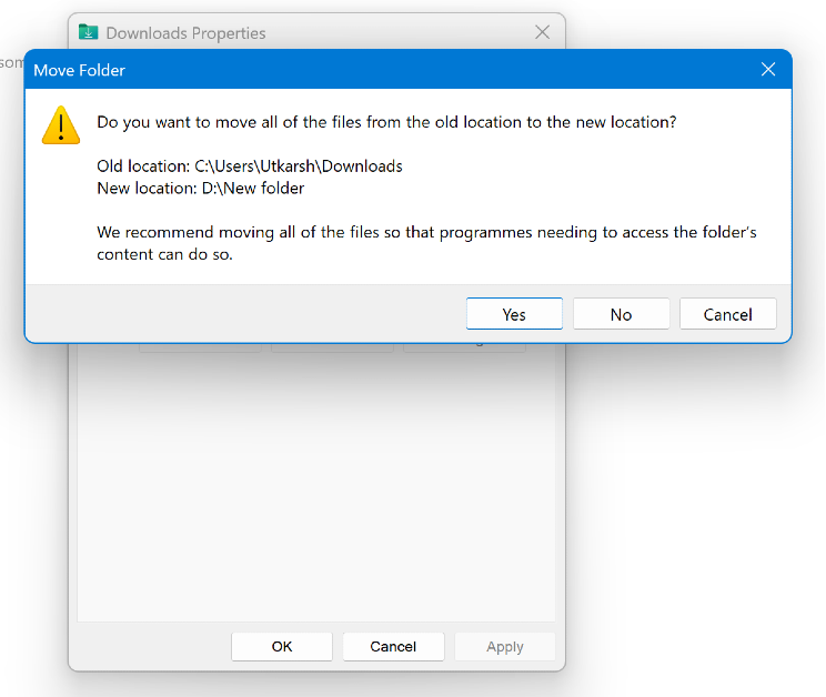 Step 6: You will be asked whether you want to move the files in the current Downloads folder to the new one. Select Yes or No.